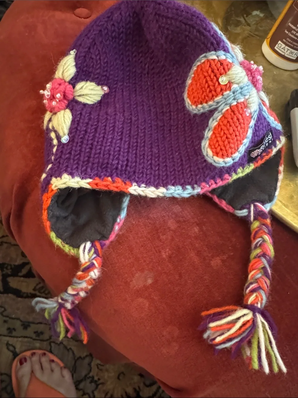 Everest Designs Purple Floral Knit Earflap Hat for Kids with Braided Tassels